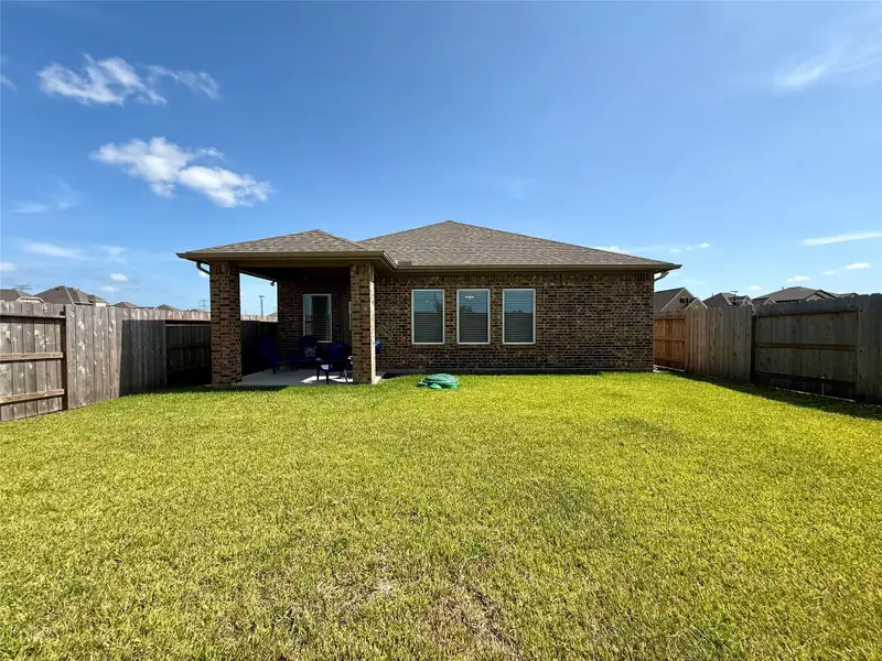 Exterior details and patio area of a home in , Angleton (Image 31).