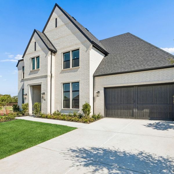 Front exterior of a new home in The Parks at Wilson Creek, Celina, TX, highlighting curb appeal (Image 25). Front exterior of a new home in The Parks at Wilson Creek, Celina, TX, highlighting curb appeal (Image 25).