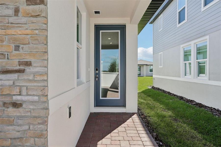 Exterior details and patio area of a home in Springs at Lake Alfred - Classic Series, Lake Alfred (Image 4).