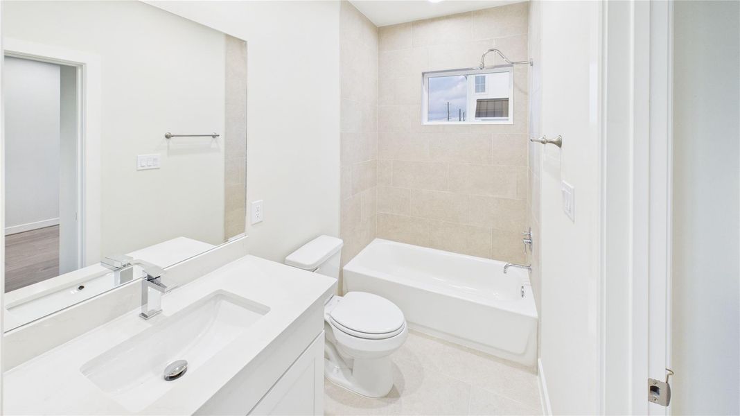 Secondary bathroom serving the additional bedrooms.