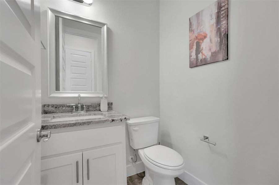 Bathroom featuring vanity and toilet