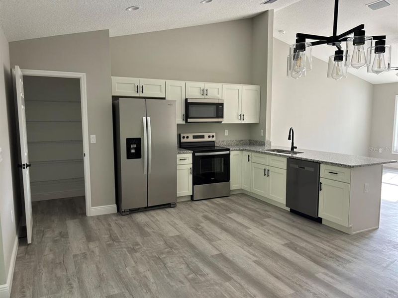 Furnished interior view inside a new home in , Dunnellon (Image 7).