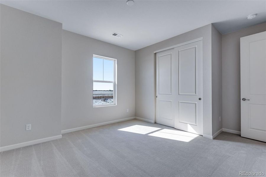 Spacious, unfurnished interior of a new home in Medley at Reunion Ridge, Commerce City (Image 34).