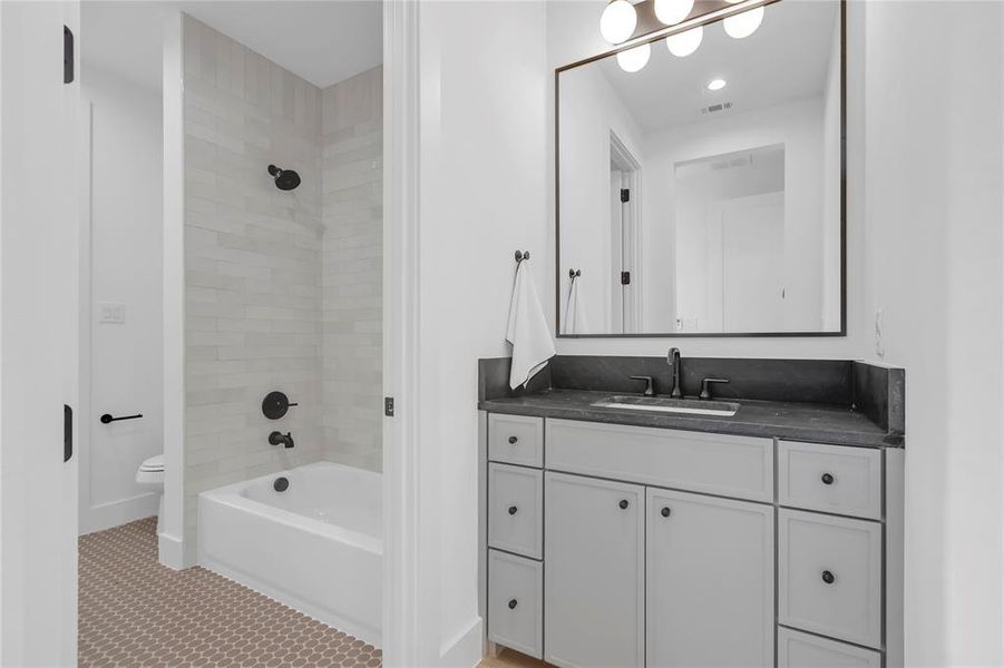 Full bath featuring vanity, shower / bathtub combination, and recessed lighting Full bath featuring vanity, shower / bathtub combination, and recessed lighting
