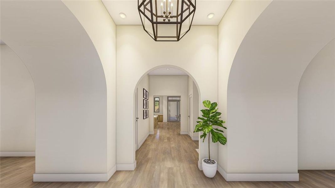 Barrel-vaulted entries lead to the study on the right and the formal dining room on the left.