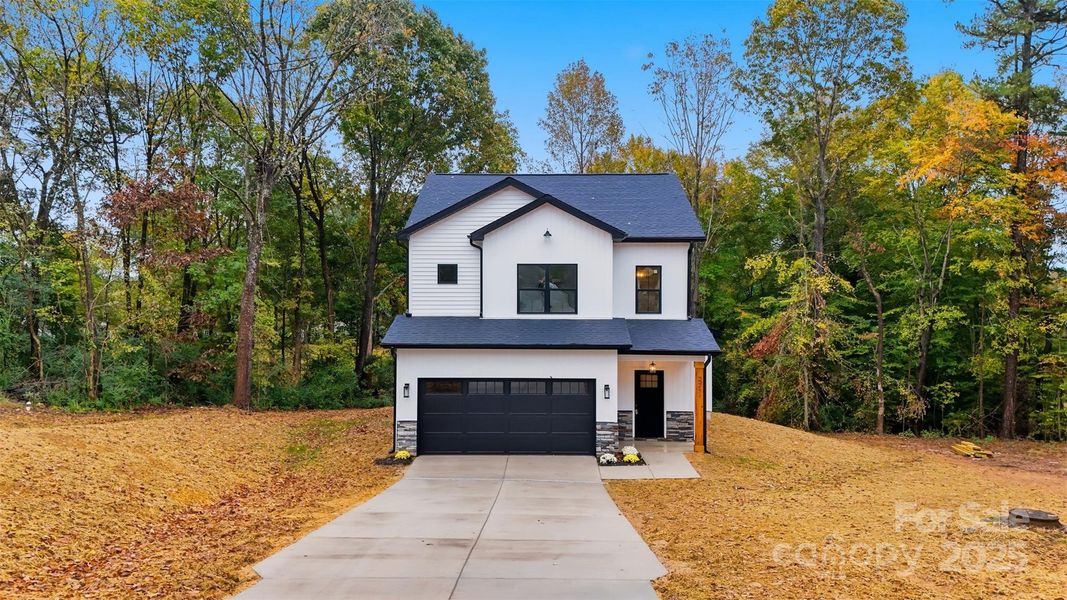 Front exterior of a new home in , Mount Holly, NC, highlighting curb appeal (Image 21). Front exterior of a new home in , Mount Holly, NC, highlighting curb appeal (Image 21).
