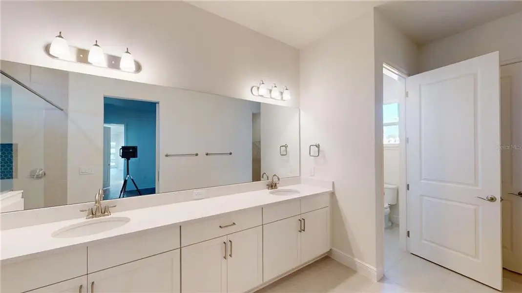 Furnished interior view inside a new home in Laureate Park, Orlando (Image 7).