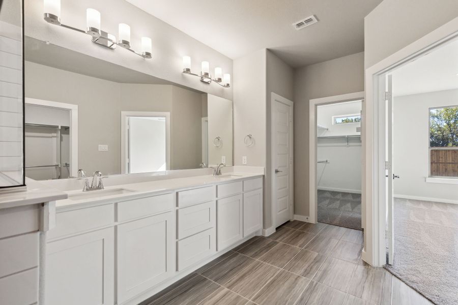 Primary Bathroom in the Morrison home plan by Trophy Signature Homes – REPRESENTATIVE PHOTO