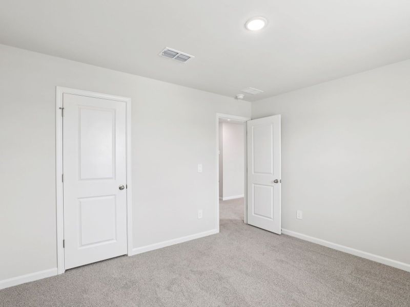 Spacious, unfurnished interior of a new home in River Glen, Angier (Image 19).