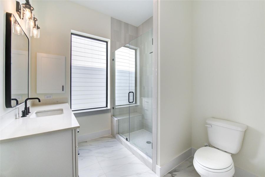 Secondary bathroom with walk-in shower. Secondary bathroom with walk-in shower.