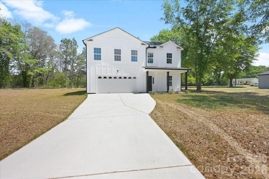 Front exterior of a new home in , Pageland, SC, highlighting curb appeal (Image 24).