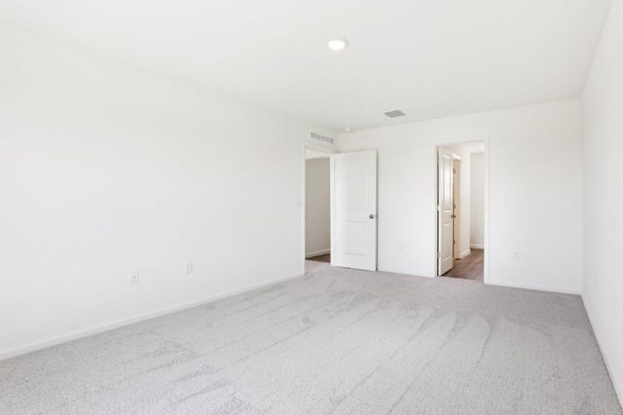 A hallway with white walls.