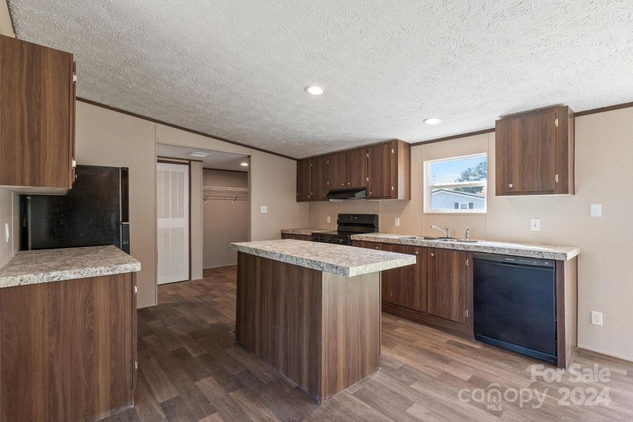 Lots of Cabinets and Beautiful Island in the Kitchen