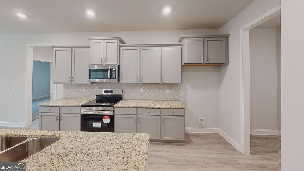 Furnished interior view inside a new home in Holliday Pass, Griffin (Image 6).