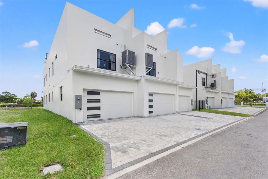 Front exterior of a new home in , Pinellas Park, FL, highlighting curb appeal (Image 24).