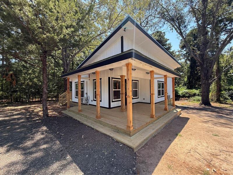 view of house featuring a large porch and board and batten siding