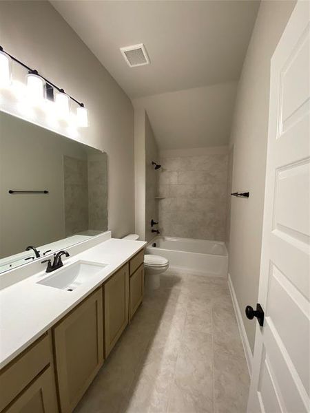 Bath 3 upstairs with quartz counters & 12x24 oversized tile. Bath 3 upstairs with quartz counters & 12x24 oversized tile.