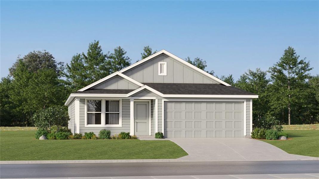 View of front of house featuring a front yard and a garage