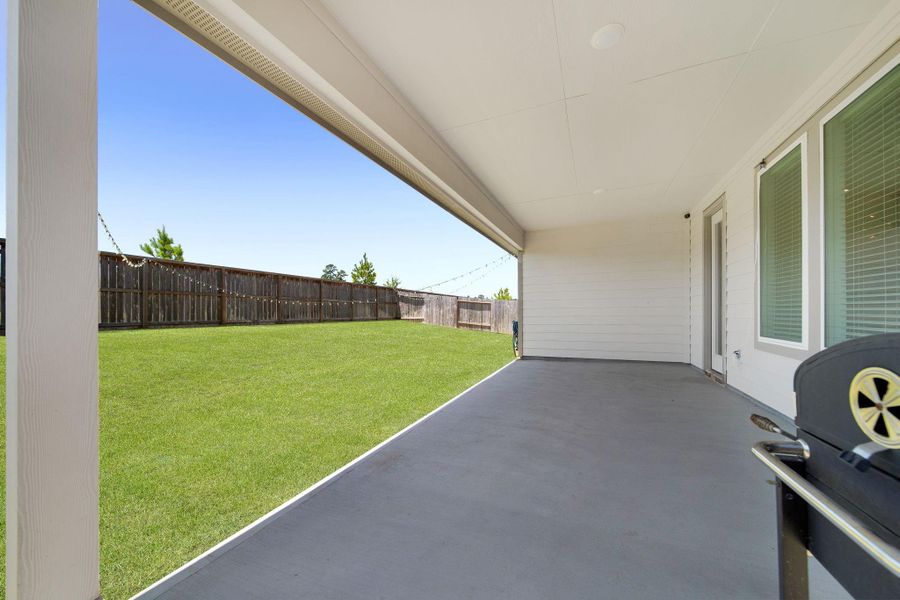 Out back, enjoy a spacious covered patio and no rear neighbors, perfect for creating your own private oasis.