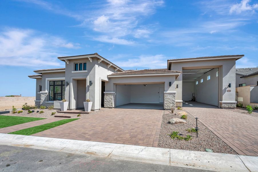 Front exterior of a new home in Alta at Verrado Regent Hills, Buckeye, AZ, highlighting curb appeal (Image 2). Front exterior of a new home in Alta at Verrado Regent Hills, Buckeye, AZ, highlighting curb appeal (Image 2).