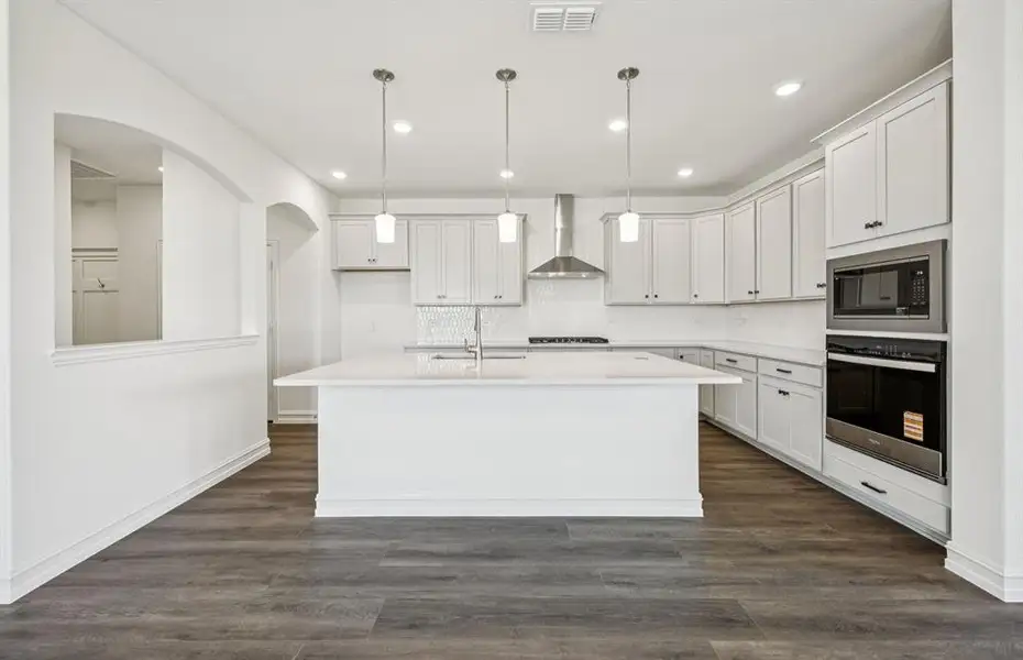 Spacious eat-in kitchen designed with a large island for dining *Real home pictured Spacious eat-in kitchen designed with a large island for dining *Real home pictured