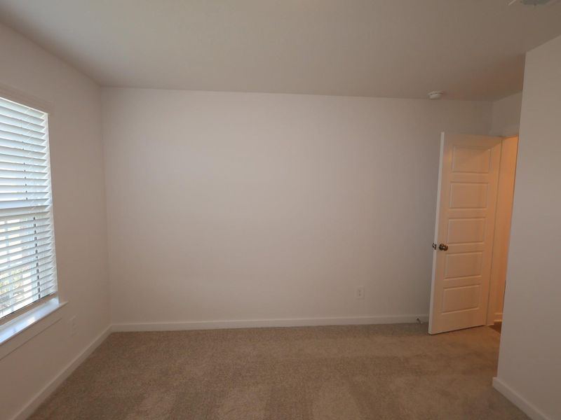 Spacious, unfurnished interior of a new home in Pinewood at Grand Texas, New Caney (Image 17).