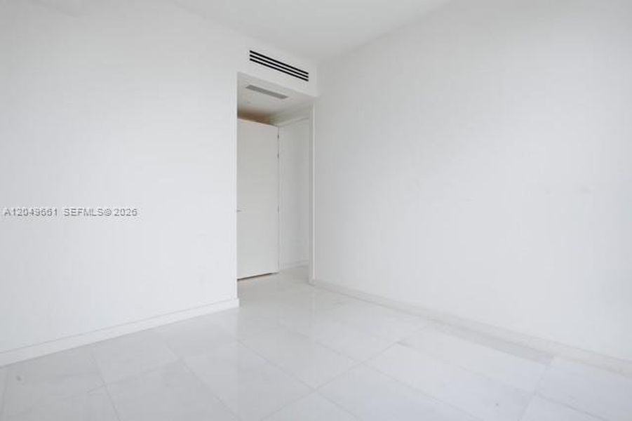 Spacious, unfurnished interior of a new home in Aston Martin Residences, Miami (Image 19).