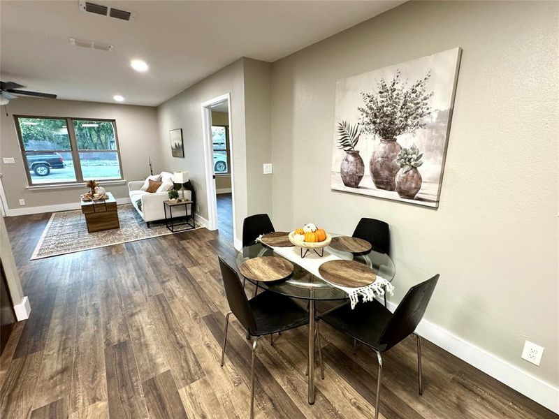 Dining room featuring dark wood finished floors, recessed lighting, and a ceiling fan