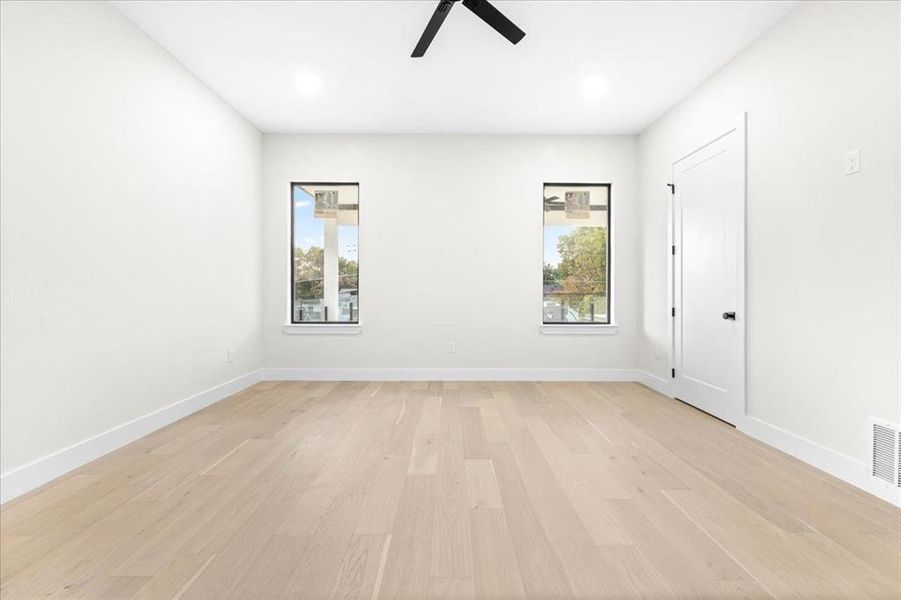 Spare room with light hardwood / wood-style floors