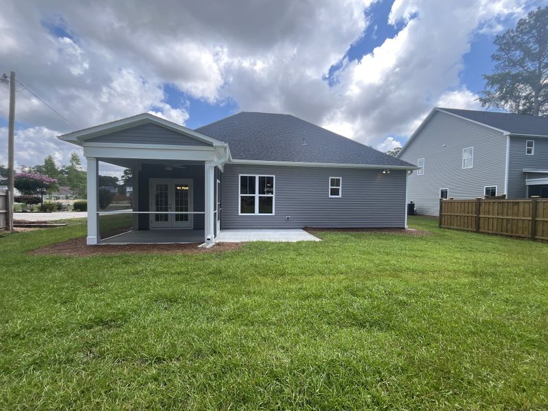 Exterior details and patio area of a home in Parkwood Estates, Leland (Image 3).