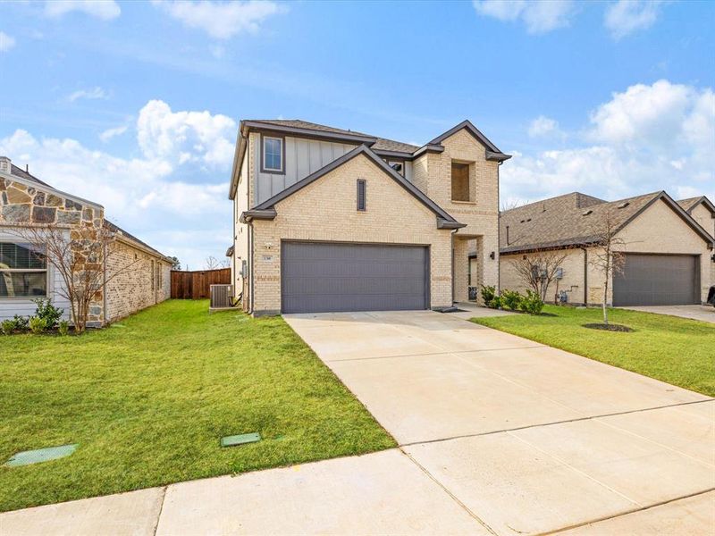 Front exterior of a new home in , Forney, TX, highlighting curb appeal (Image 1). Front exterior of a new home in , Forney, TX, highlighting curb appeal (Image 1).