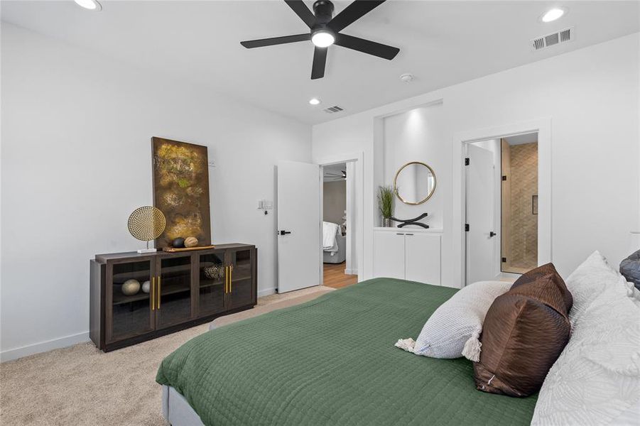 Bedroom featuring ensuite bath, carpet flooring, a ceiling fan, and recessed lighting Bedroom featuring ensuite bath, carpet flooring, a ceiling fan, and recessed lighting