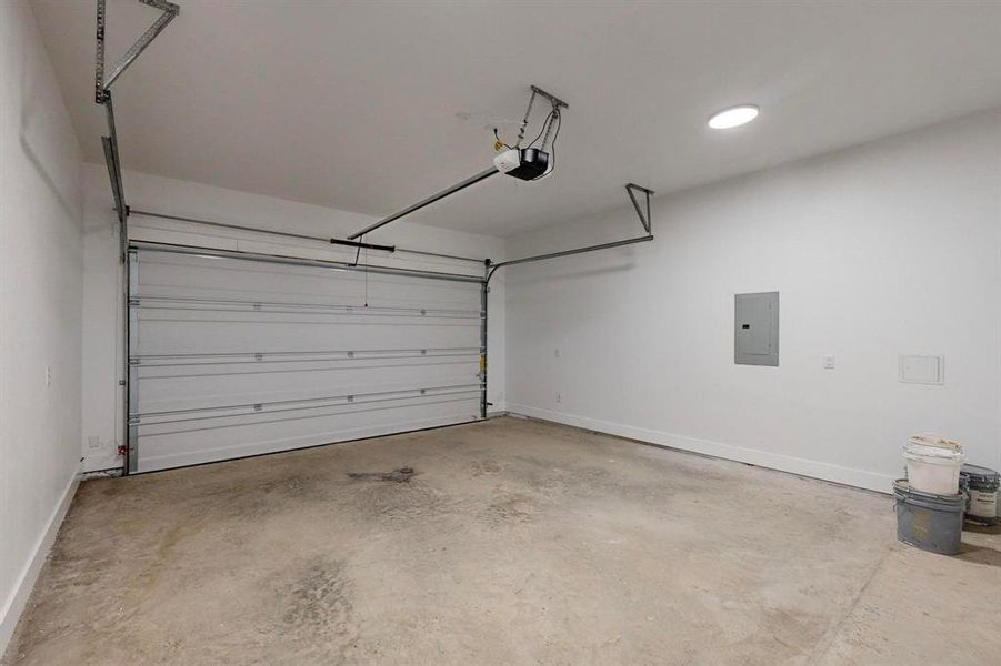 Spacious two-car garage featuring a sectional overhead door and automatic opener Spacious two-car garage featuring a sectional overhead door and automatic opener