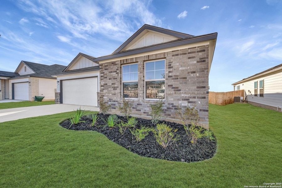 Front exterior of a new home in Greenspoint Heights, Seguin, TX, highlighting curb appeal (Image 1).