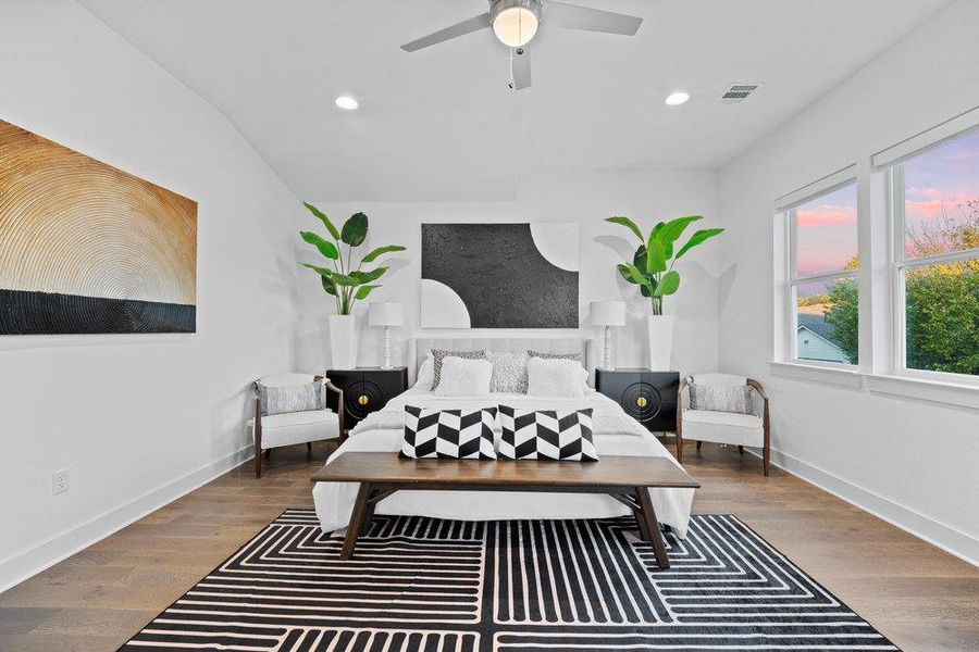 Bedroom with dark wood finished floors, recessed lighting, and a ceiling fan