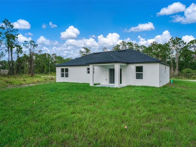 Exterior details and patio area of a home in , Sebring (Image 3).