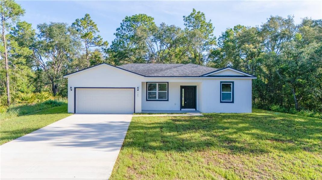 Front exterior of a new home in , Ocklawaha, FL, highlighting curb appeal (Image 13). Front exterior of a new home in , Ocklawaha, FL, highlighting curb appeal (Image 13).