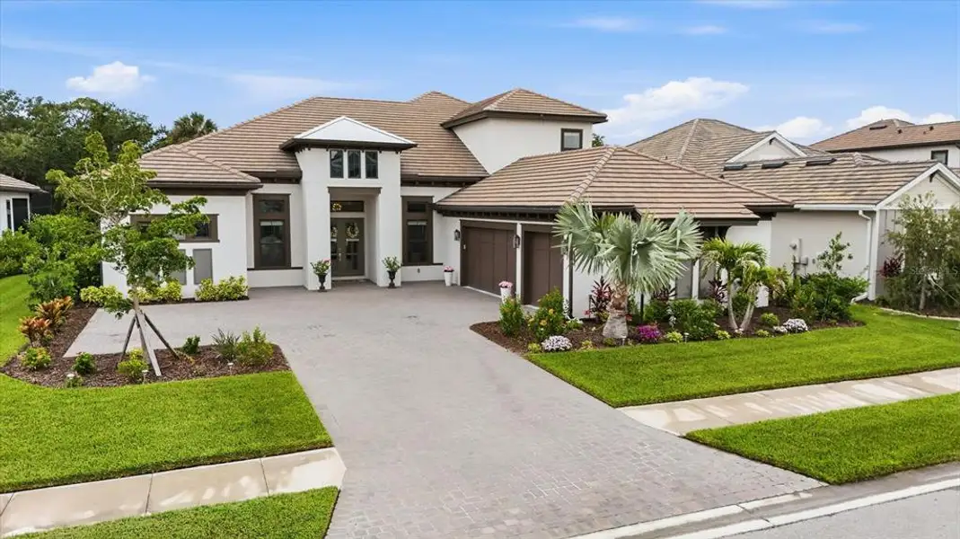 Front exterior of a new home in , Sarasota, FL, highlighting curb appeal (Image 21).