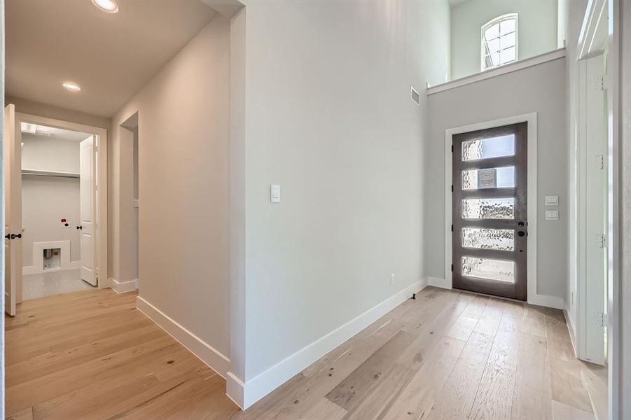 Entrance foyer featuring light hardwood / wood-style floors