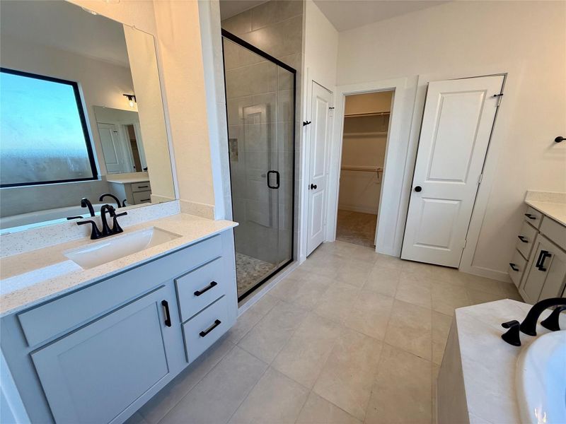 Split vanities provide ample counter space and storage, allowing two people to get ready simultaneously without feeling crampled.