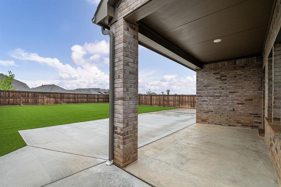 Stunning curb appeal with upgraded flowerbed & tree stonework plus a beautiful modern door.