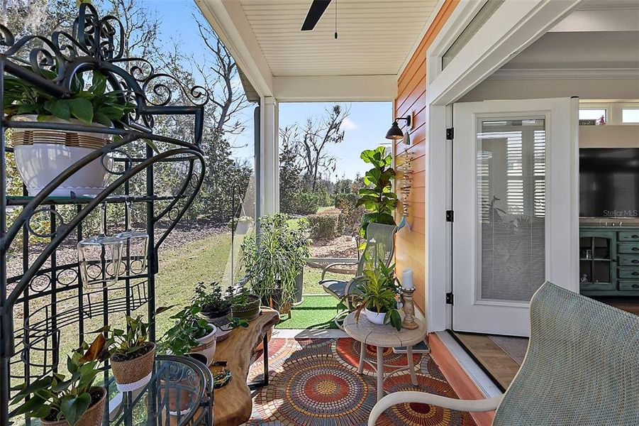 Screened in back porch with serene views.