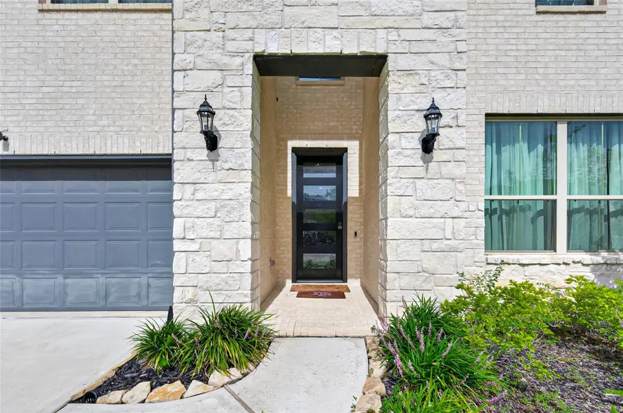 Exterior details and patio area of a home in Sunterra, Katy (Image 3). Exterior details and patio area of a home in Sunterra, Katy (Image 3).
