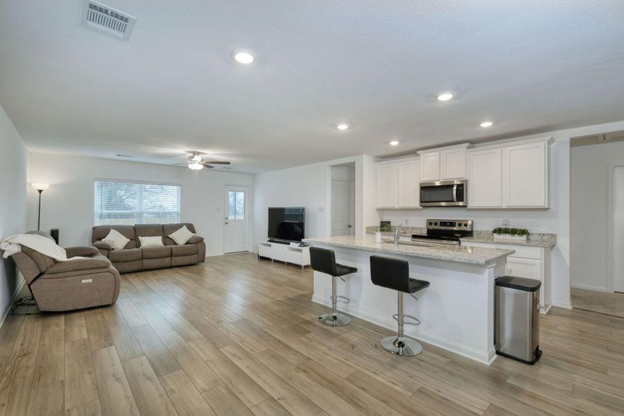 Open Floor Plan - View of Kitchen, dining and living room.