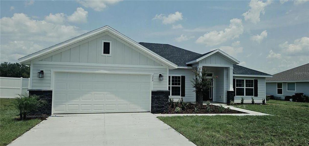 Front exterior of a new home in The Preserve at Laurel Lake, Lake City, FL, highlighting curb appeal (Image 1). Front exterior of a new home in The Preserve at Laurel Lake, Lake City, FL, highlighting curb appeal (Image 1).