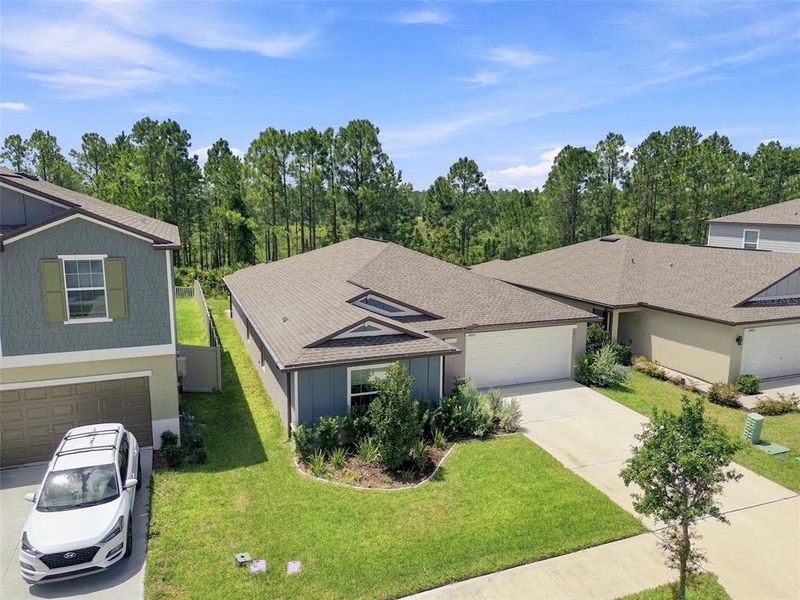 Front exterior of a new home in , Zephyrhills, FL, highlighting curb appeal (Image 26). Front exterior of a new home in , Zephyrhills, FL, highlighting curb appeal (Image 26).