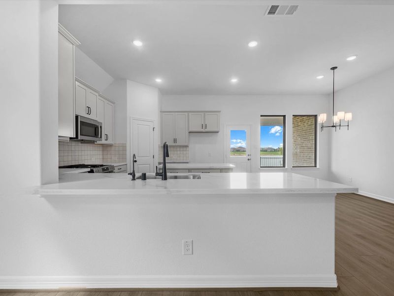 Kitchen. Sample product photo. Actual exterior and interior selections may vary by homesite. Photo may be virtually staged. Kitchen. Sample product photo. Actual exterior and interior selections may vary by homesite. Photo may be virtually staged.