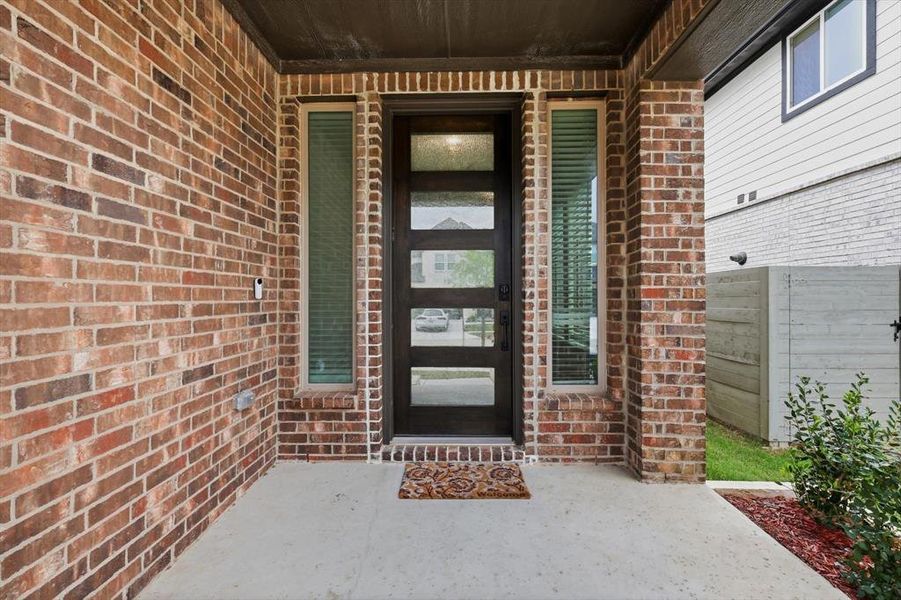 Exterior details and patio area of a home in Harvest, Argyle (Image 24).