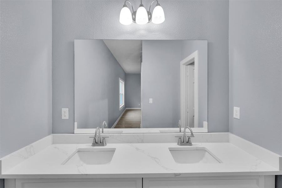 Bathroom featuring double vanity