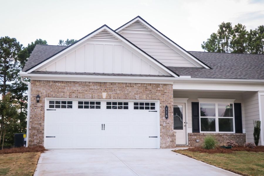 Front exterior of a new home in The Cottages of Silvertown, Thomaston, GA, highlighting curb appeal (Image 1). Front exterior of a new home in The Cottages of Silvertown, Thomaston, GA, highlighting curb appeal (Image 1).